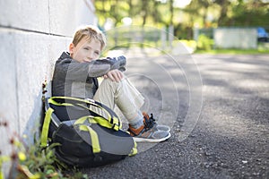 Student boy outside at school standing