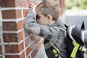 Student boy outside at school standing