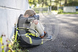 Student boy outside at school standing