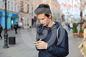 Student boy using digital tablet computer or mobile smart phon