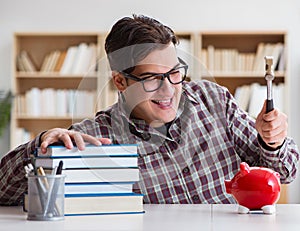 Student breaking piggybank to pay for tuition fees