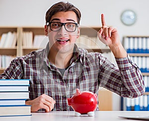 Student breaking piggybank to pay for tuition fees