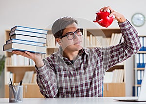 Student breaking piggybank to pay for tuition fees