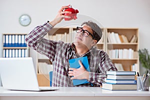 The student breaking piggybank to pay for tuition fees