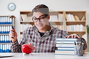 The student breaking piggybank to pay for tuition fees