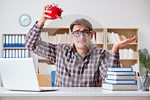 The student breaking piggybank to pay for tuition fees