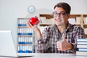 The student breaking piggybank to pay for tuition fees