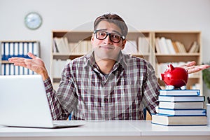 The student breaking piggybank to pay for tuition fees