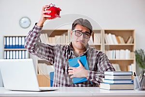 The student breaking piggybank to pay for tuition fees