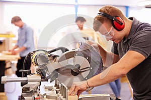 Student In Carpentry Class Using Circular Saw
