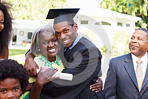 Student Celebrates Graduation With Parents photo