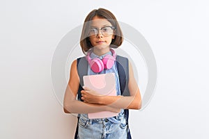 Student child girl wearing backpack glasses book headphones over isolated white background with a confident expression on smart