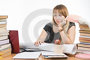 Student with contempt and weariness looking laptop monitor