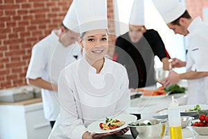 Student cooking apprentice amongst the group