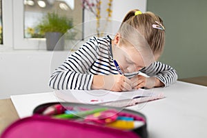 Student doing homework in workbook