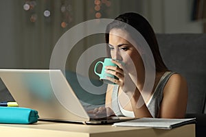 Student drinking and studying late hours in the night