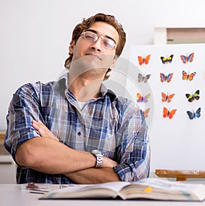 Student entomologist studying new species of butterflies