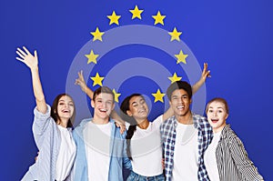 Student Exchange Programs In Eu. Multiracial Teens Posing Over Europe Union Flag