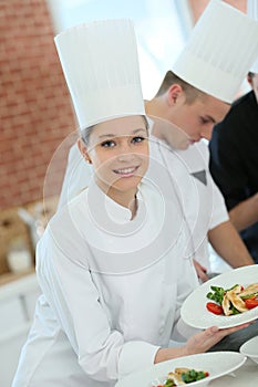 Student girl amongst the group of cooking apprentices