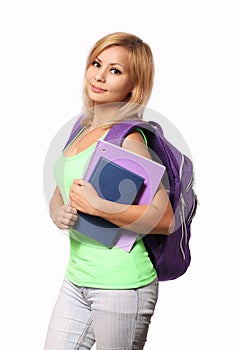 Student girl with backpack and books isolated on white