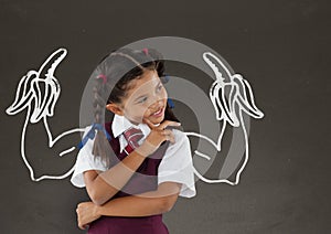 Student girl with fists graphic standing against grey blackboard