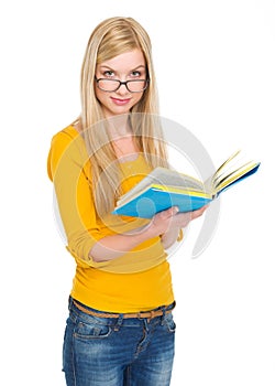 Student girl in glasses reading book