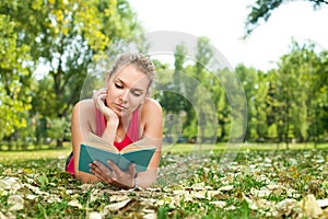 Student girl reading book outdoor