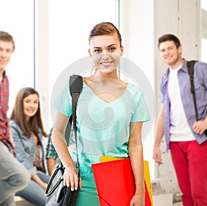 Student girl with school bag and color folders