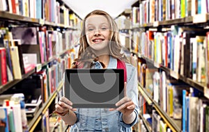 Student girl with tablet pc at school library