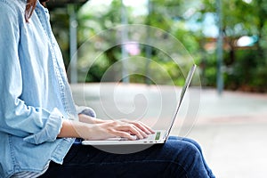 Student girl using laptop computer, online education,  adult learning concept