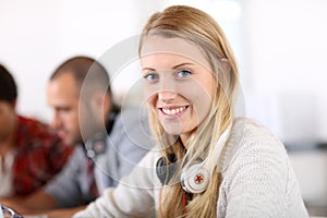 Student girl working on laptop in business class