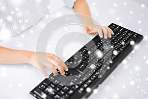 Student girls hands typing on keyboard