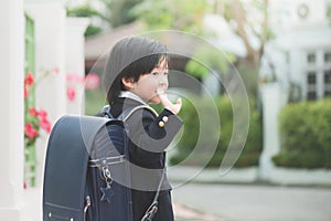 Student going to school and waving goodbye