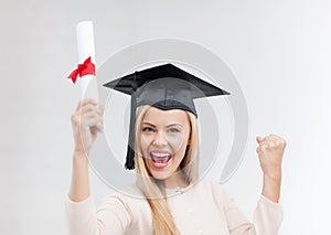 Student in graduation cap with certificate