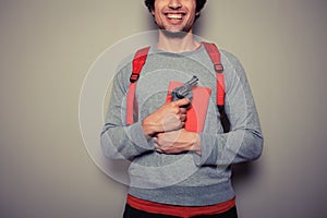 Student with gun and book