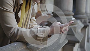 Student hands using smartphone in hallway. Businesswoman working on cellphone