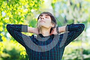 Student having break stretching arms