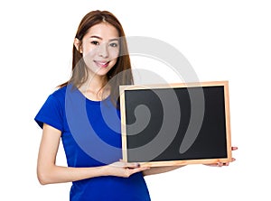 Student hold with wooden chalkboard
