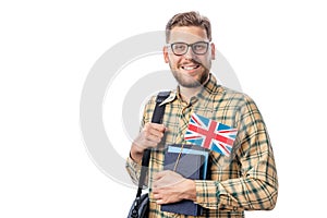 Student holding books and flag