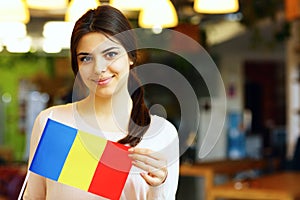 Student holding flag of Romania