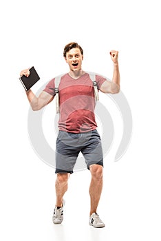 Student holding notebook and showing yeah