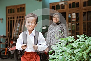 Student with indonesian school uniform getting ready to school