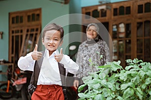 Student with indonesian school uniform getting ready to school