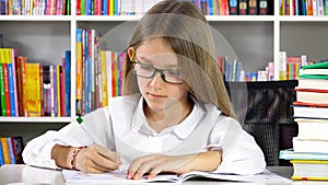 Student Kid Writing Studying in Library, Child Learning for School, Girl doing Homework at Desk Office at Home