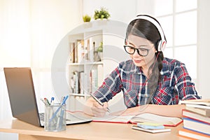 Student learning on line with headphones