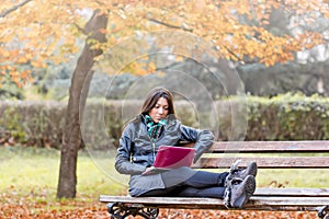 Student learns outdoors - using laptop