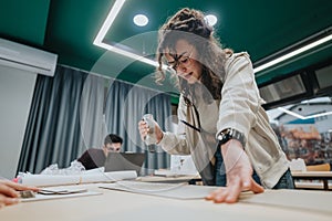 Students at a modern classroom collaborate on a design project during a hands-on workshop