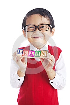 Student with letter blocks