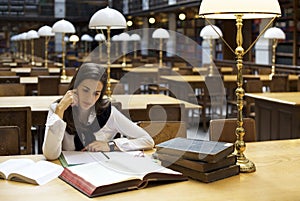 Student in library reading