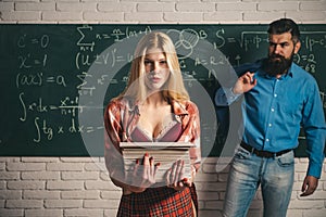 Student life. Couple of man and woman in classroom. College Students and teacher in Love together. Female student with a